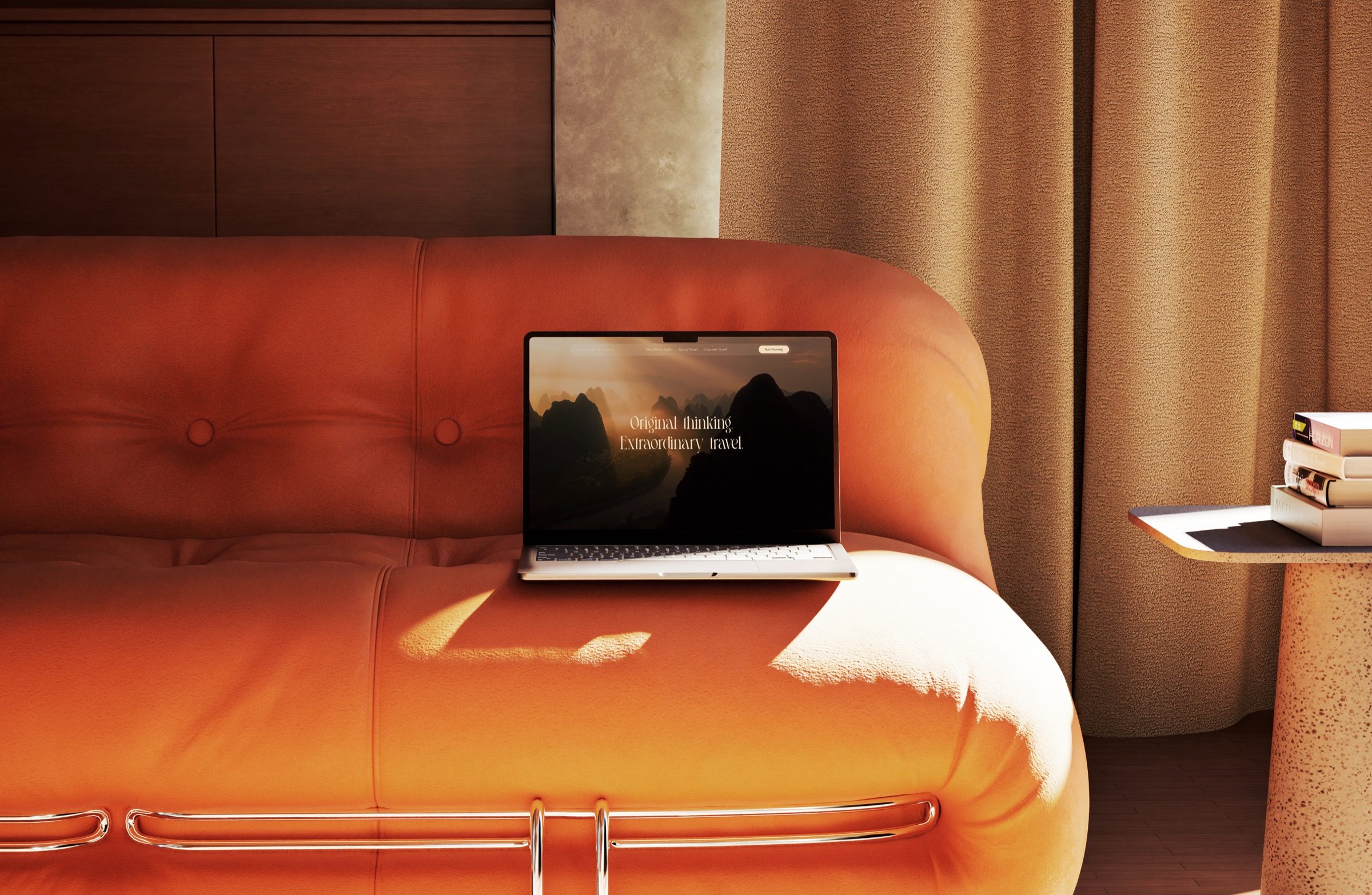 The Palmer Studio website on a laptop, resting on a terracotta sofa