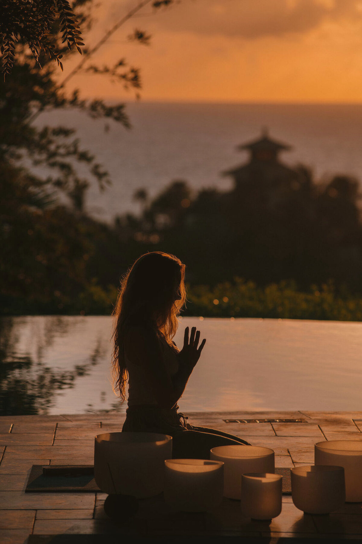A sound bath at the pool at dusk