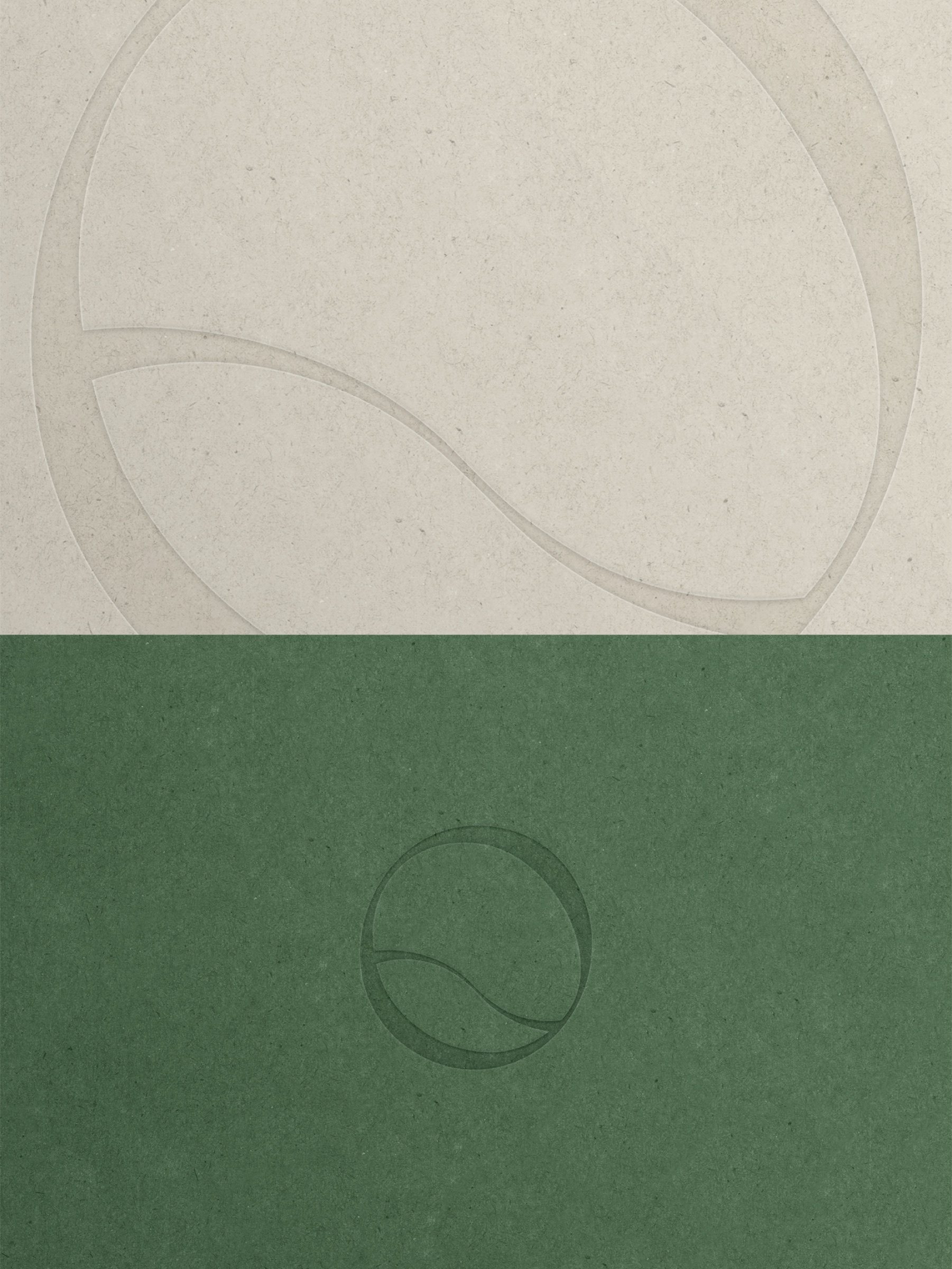 The Odisi mark embossed in stone and green paper
