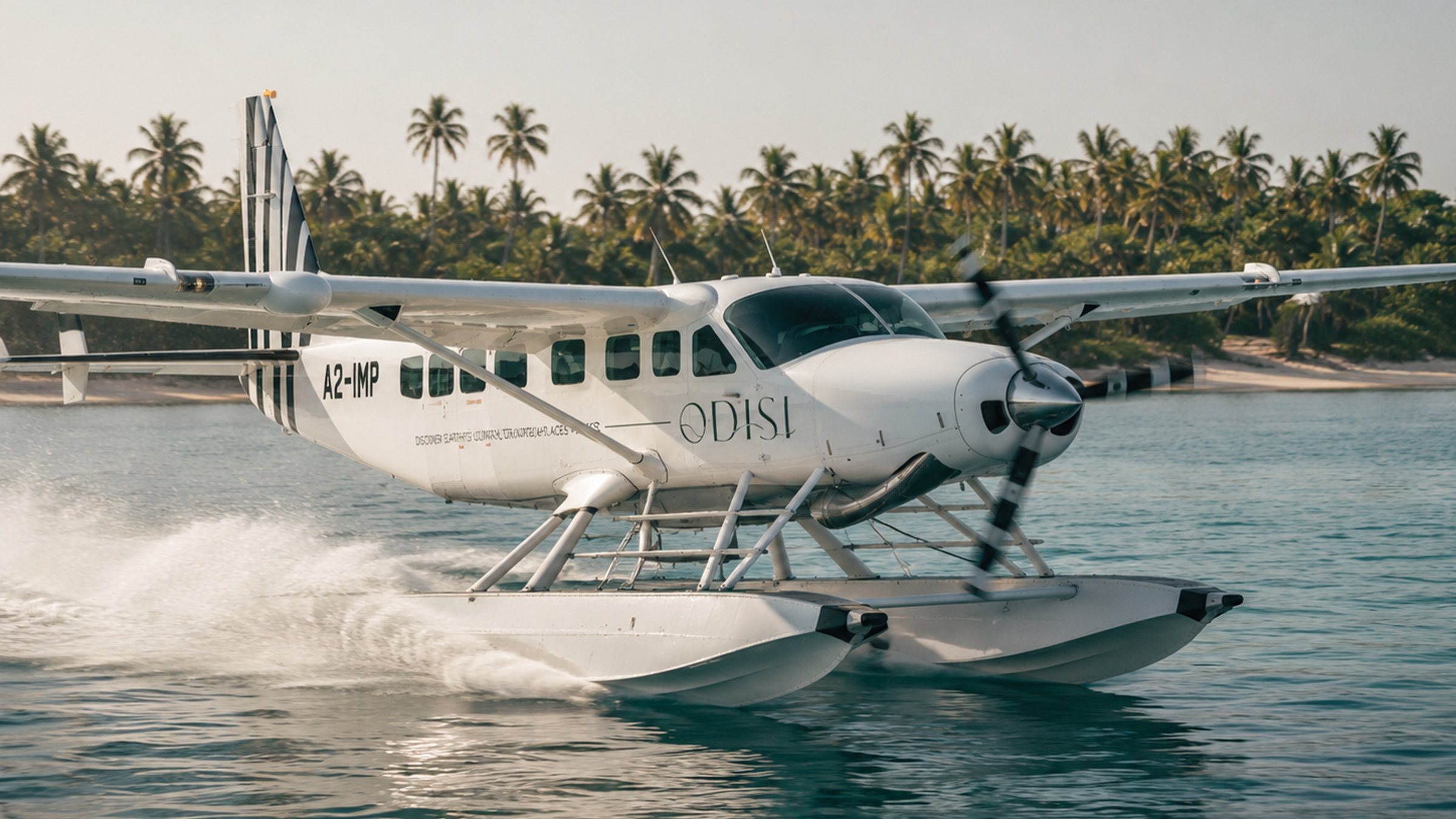 An Odisi seaplane over a turquoise bay beneath a volcano