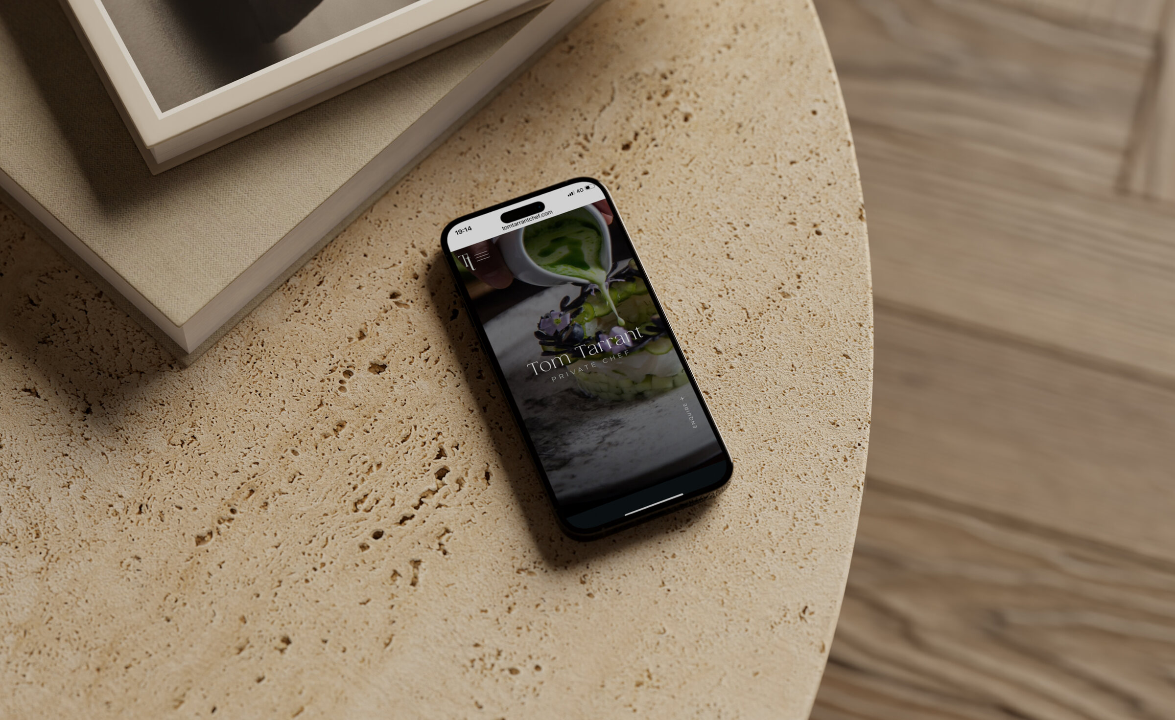 The website on a phone resting on travertine